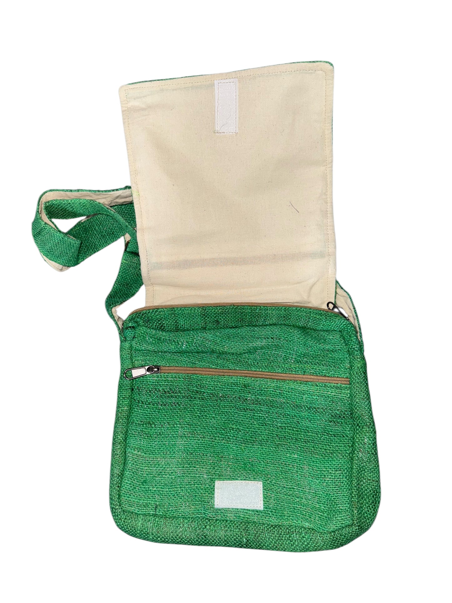 Green woven fabric crossbody bag with front zipper pocket and beige inner flap